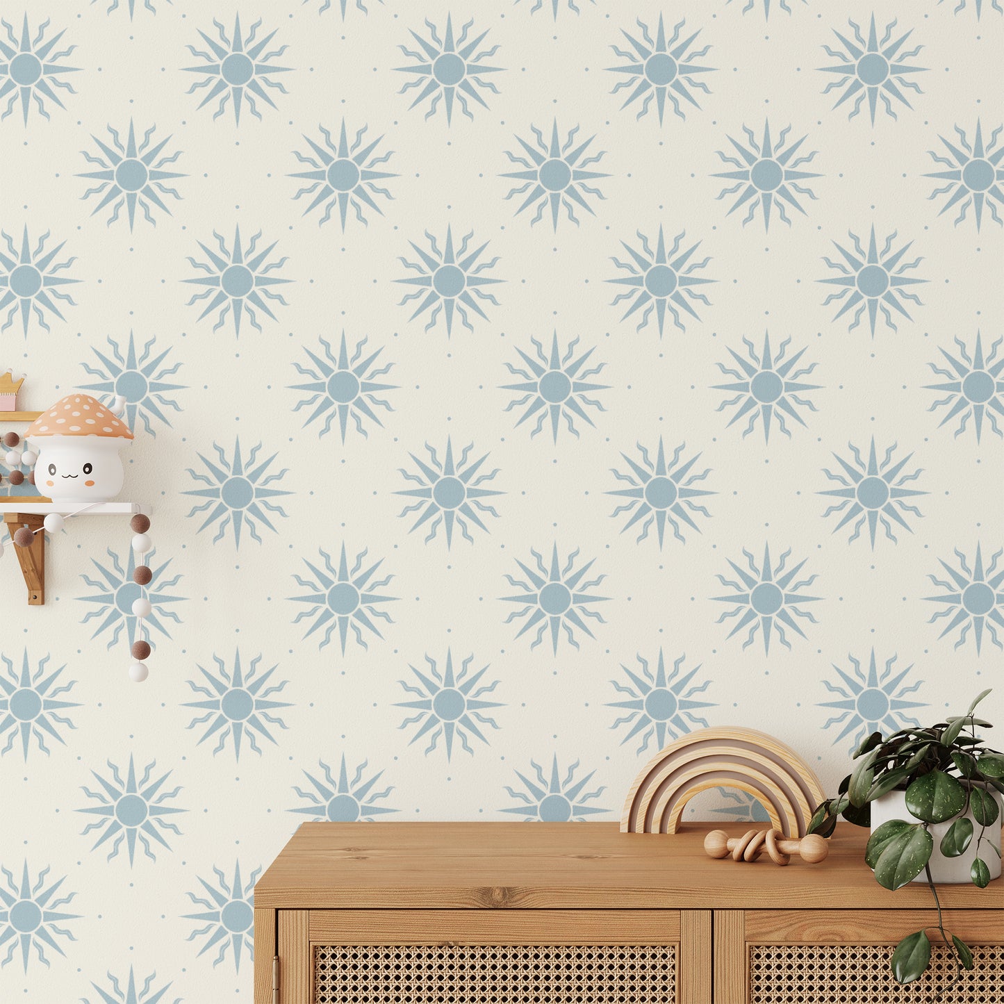 Sunny Suns Wallpaper in Blue shown in a kids bedroom.