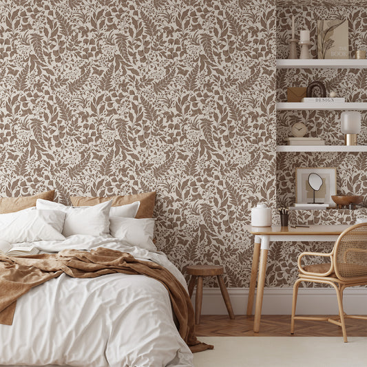 Bedroom with patterned wallpaper, bed, desk, and chair.