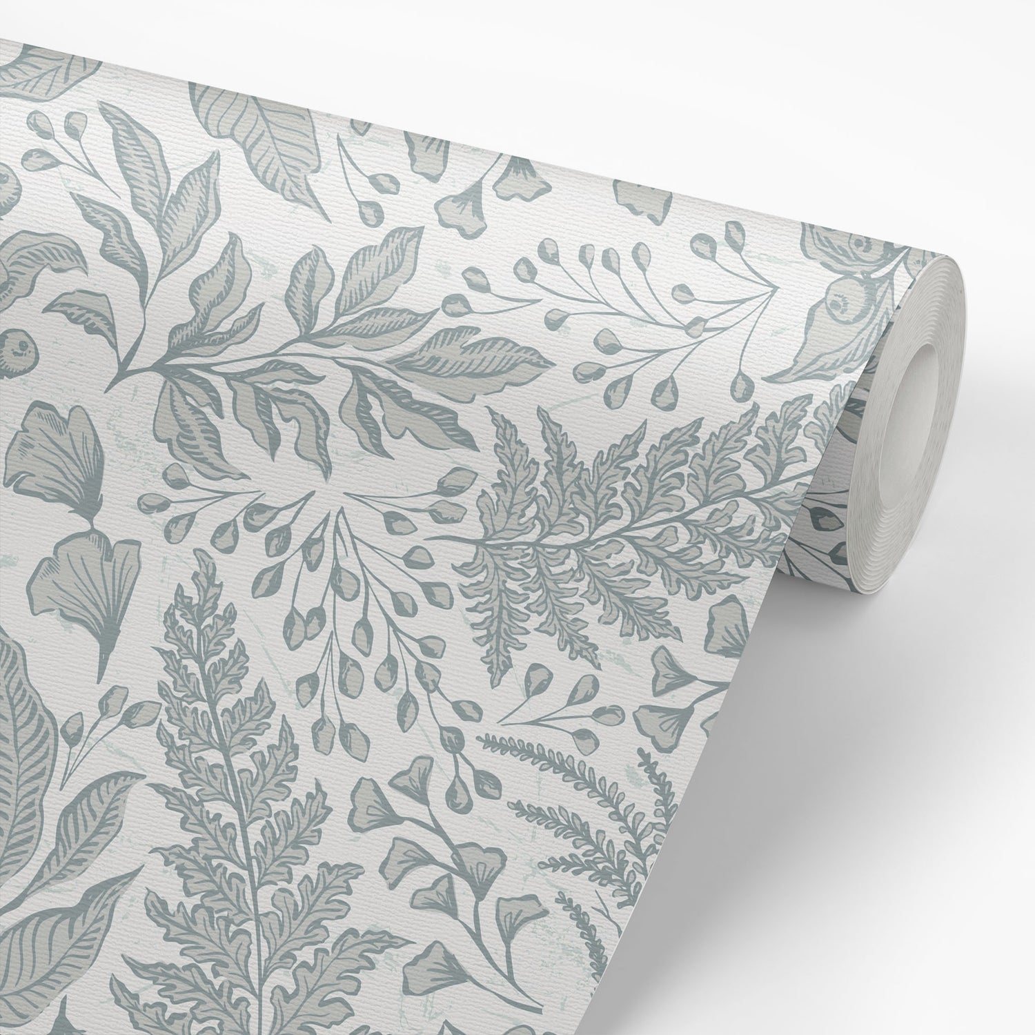Roll of wallpaper with a leaf pattern on a white background