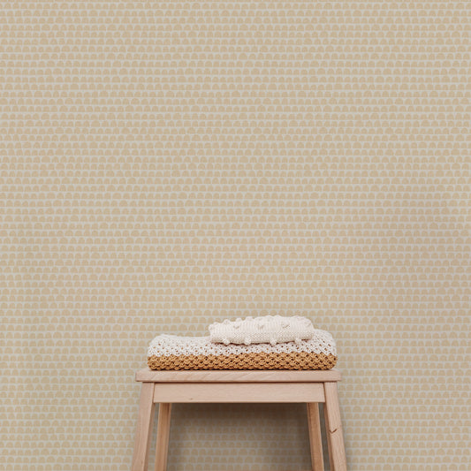 The Freehand Arches Wallpaper in Tan adds visual interest and a touch of whimsy to any room. The elegant curved motif creates a sense of depth and texture that can be appreciated from any angle, while the beige hue evokes a sense of calm and refinement.