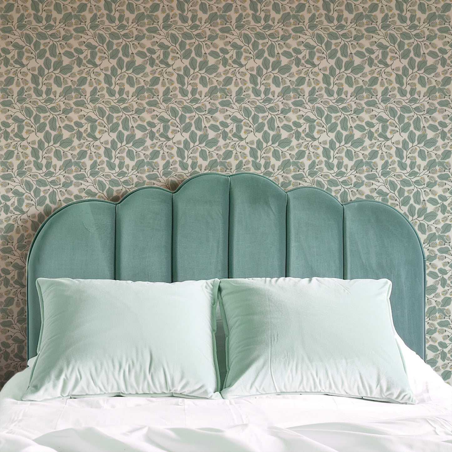 Evening Bloom Wallpaper in Sage shown in a bedroom.