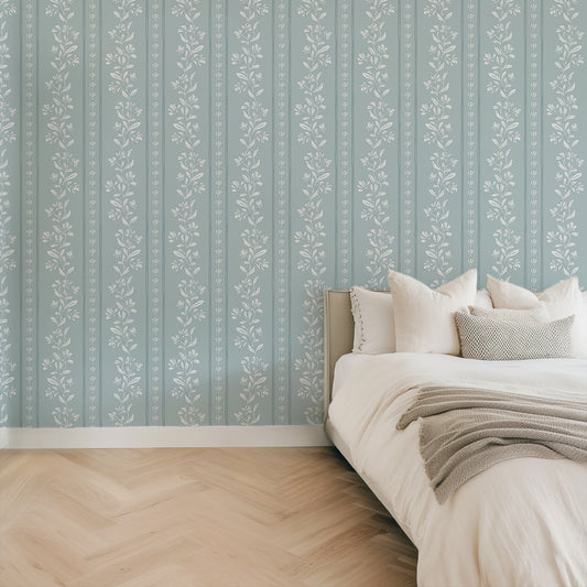 Striped Tulips Symphony Wallpaper in Cloud Blue shown in a bedroom.