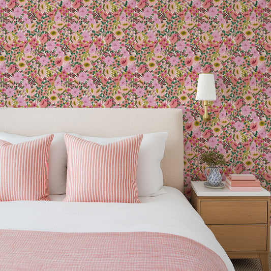 Geneva Floral Wallpaper in Pink shown in a bedroom.
