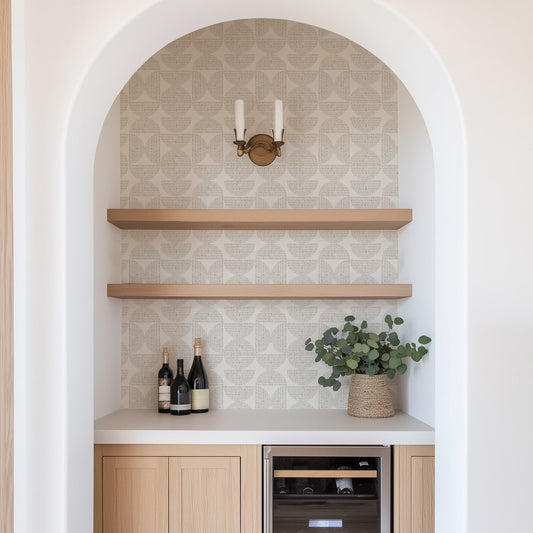 Modern kitchen with wooden shelves, wine bottles, and a plant. Featured wallpaper is Half Circle Blocks, a geometric wallpaper by Ayara.