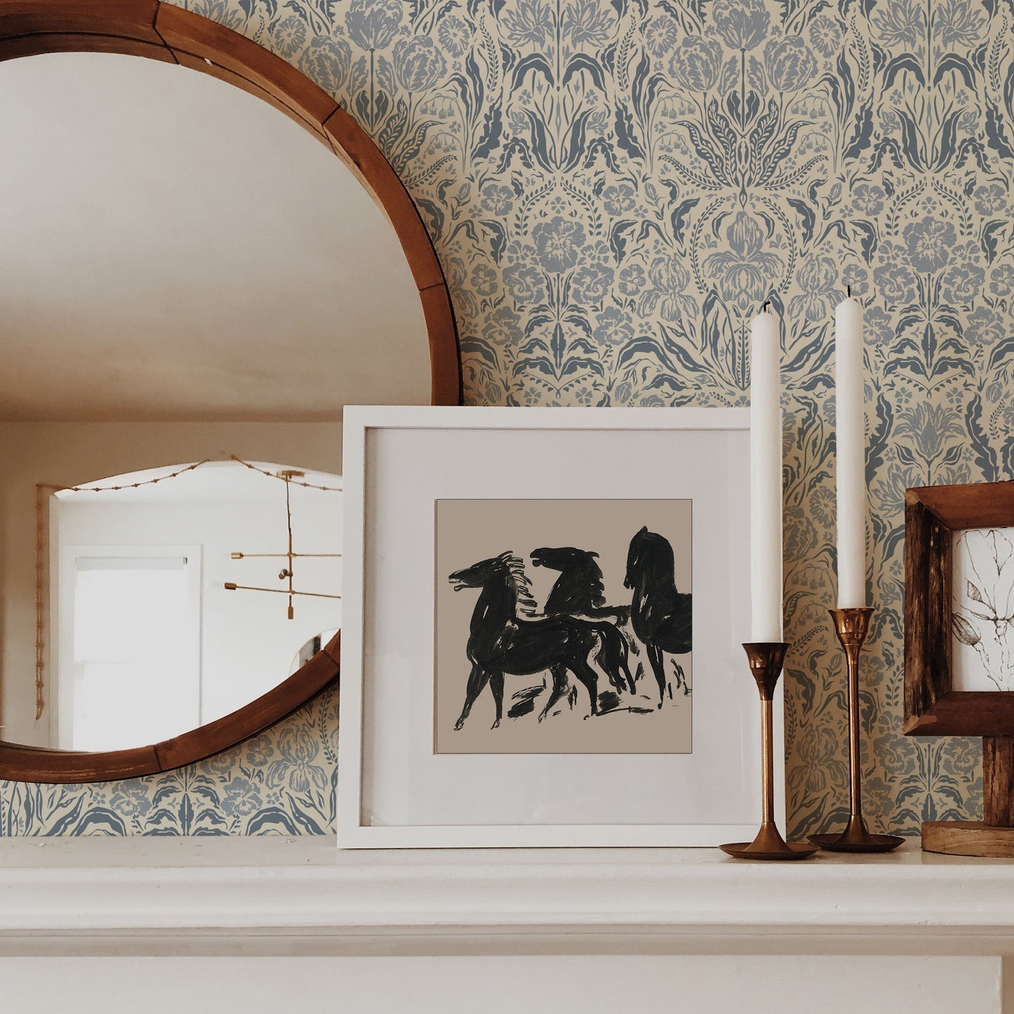 Heritage Spring Wallpaper in Cream and Blue shown on a fireplace.