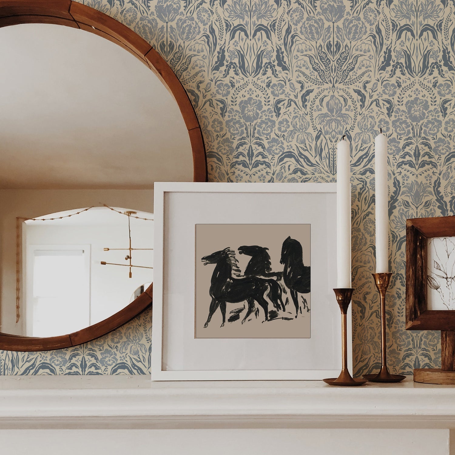Heritage Spring Wallpaper in Cream and Blue shown on a fireplace.
