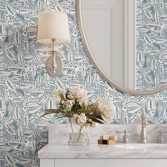 Bathroom with decorative wallpaper, vanity, and floral arrangement.