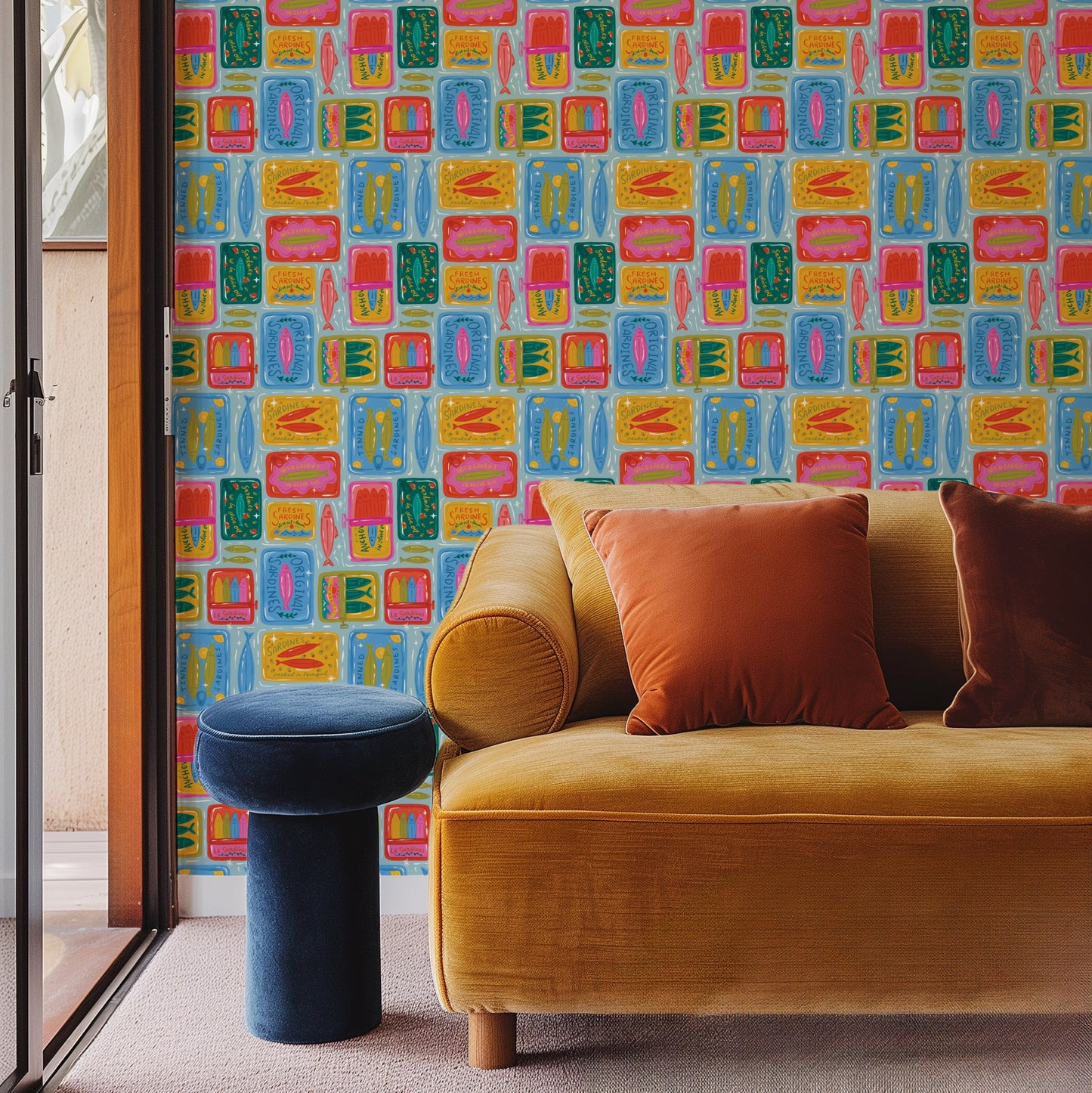 Yellow sofa with colorful cushions against a wall with geometric pattern