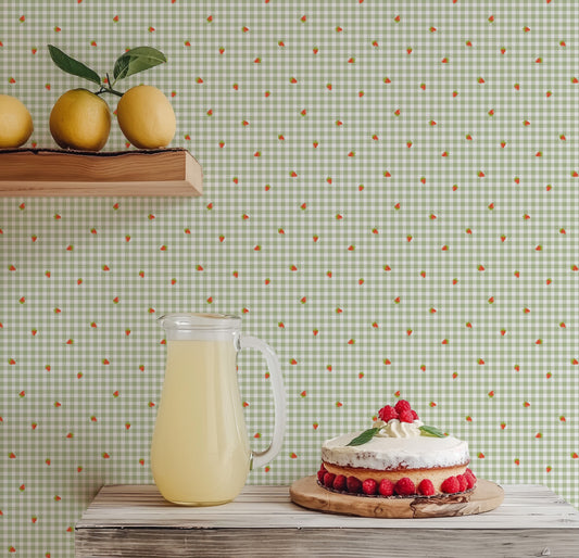 Lemonade on a wooden table against a wallpapered wall with a strawberry pattern