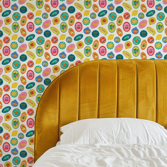 Mustard yellow headboard against a colorful patterned wall
