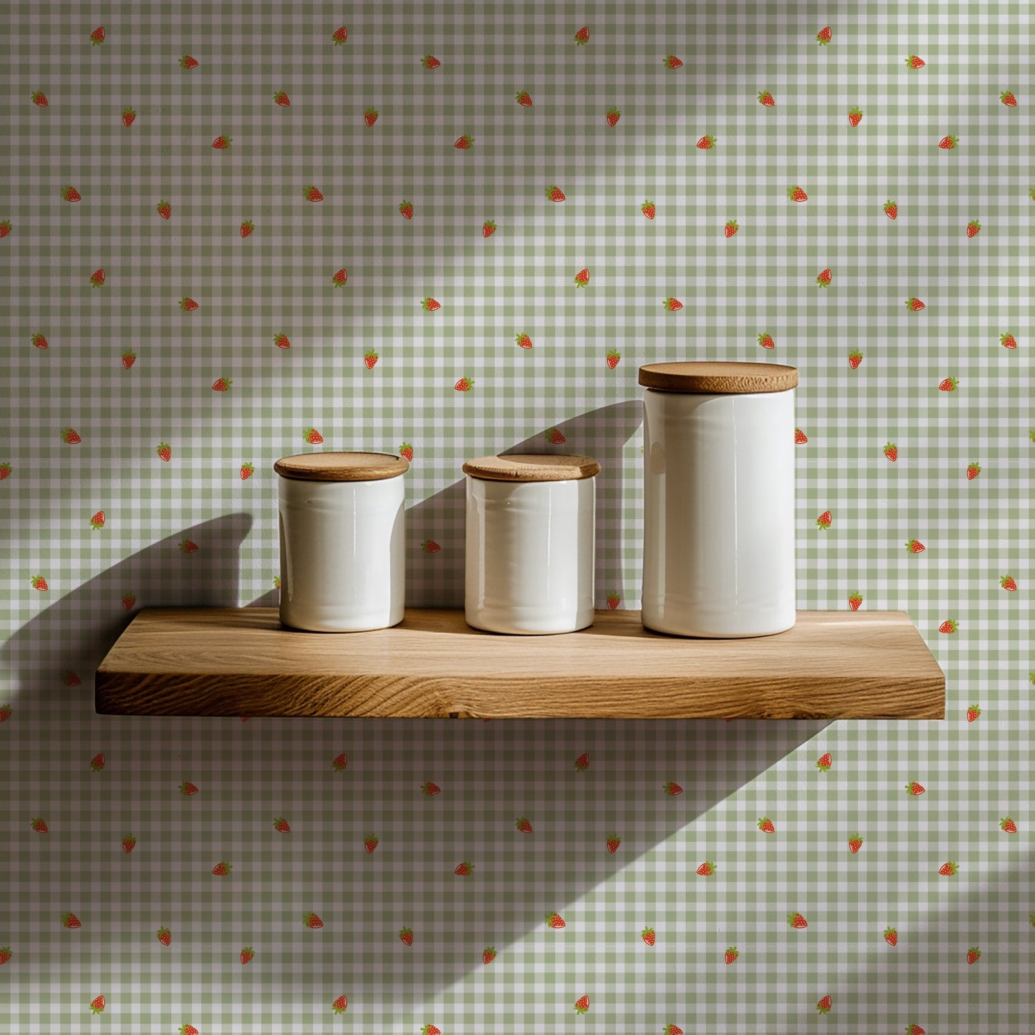 Three white ceramic jars with wooden lids on a wooden shelf against a patterned wall.
