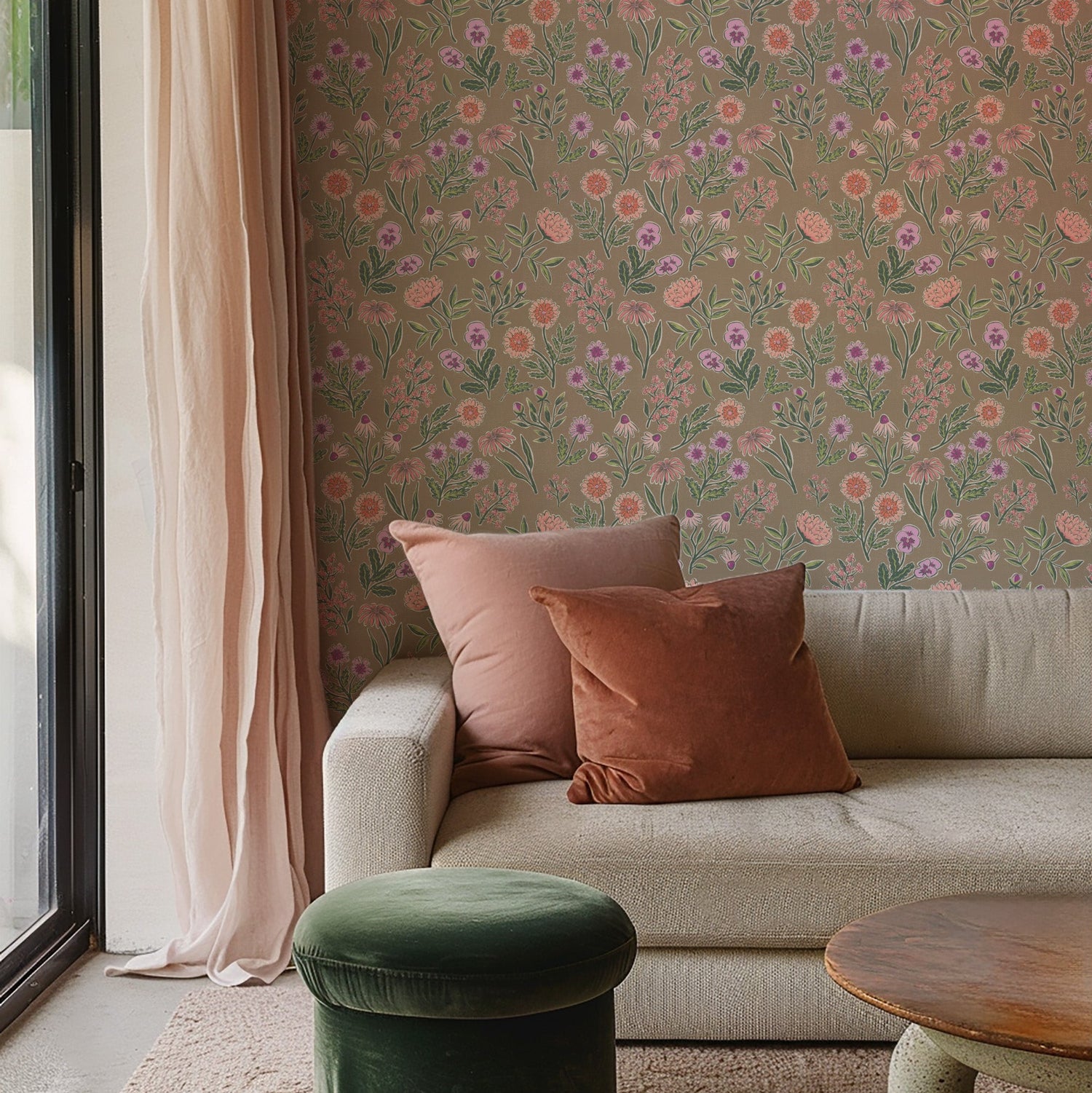 Living room with Lyla Floral wallpaper in Brown features a beige sofa, and green ottoman.