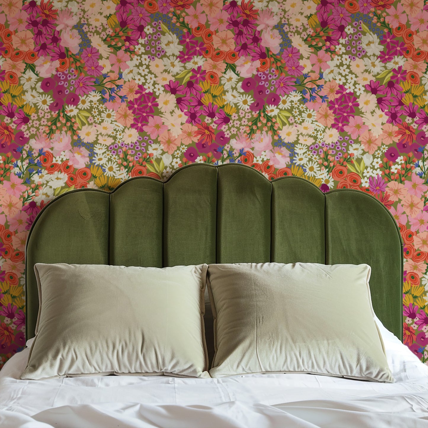 Bed with green headboard and floral wallpaper