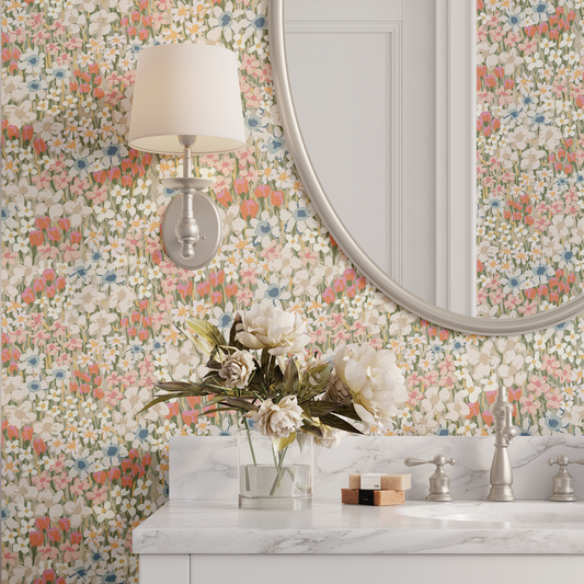 Bathroom with floral wallpaper, round mirror, and marble countertop.