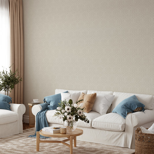 Mira Damask Wallpaper in Beige shown in a living room.