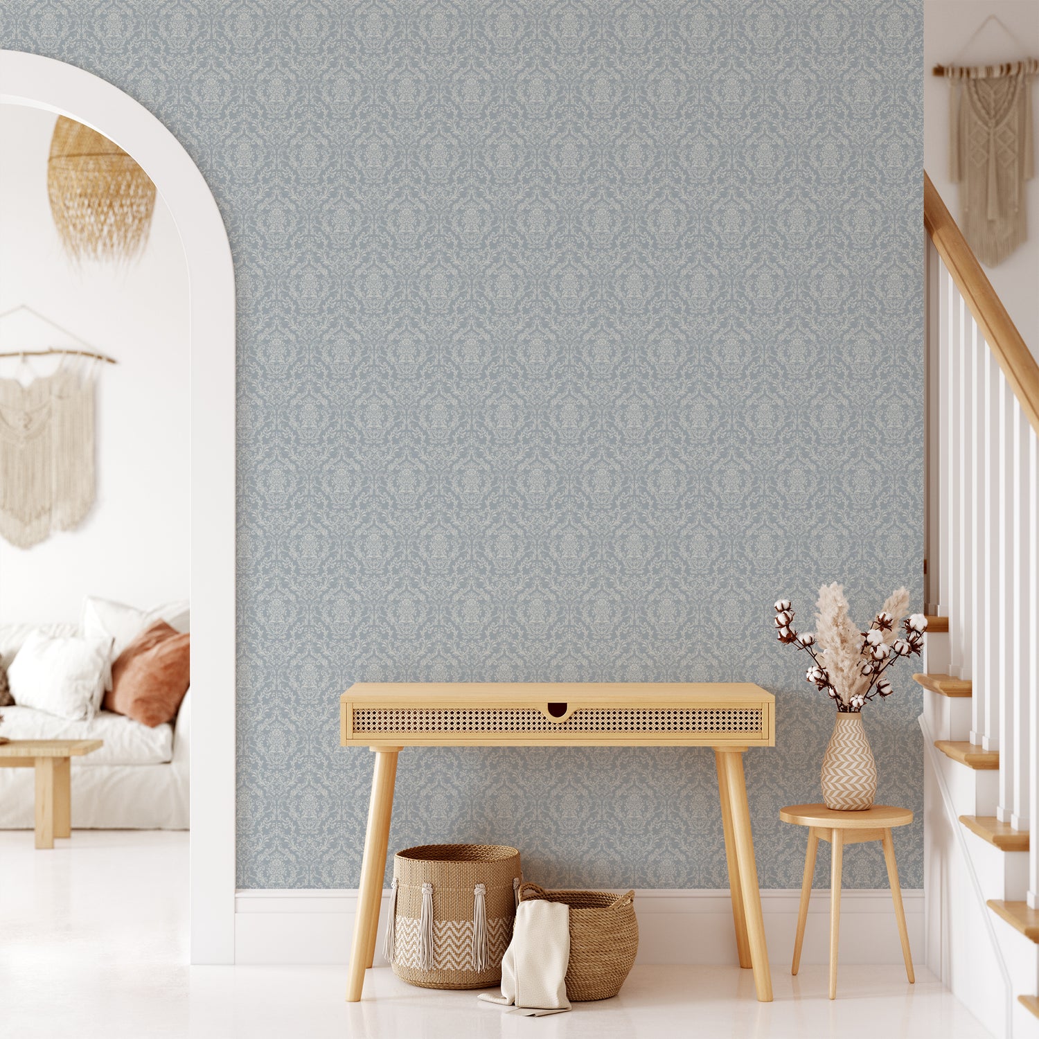 Mira Damask Wallpaper in Dusty Blue shown in a hallway.
