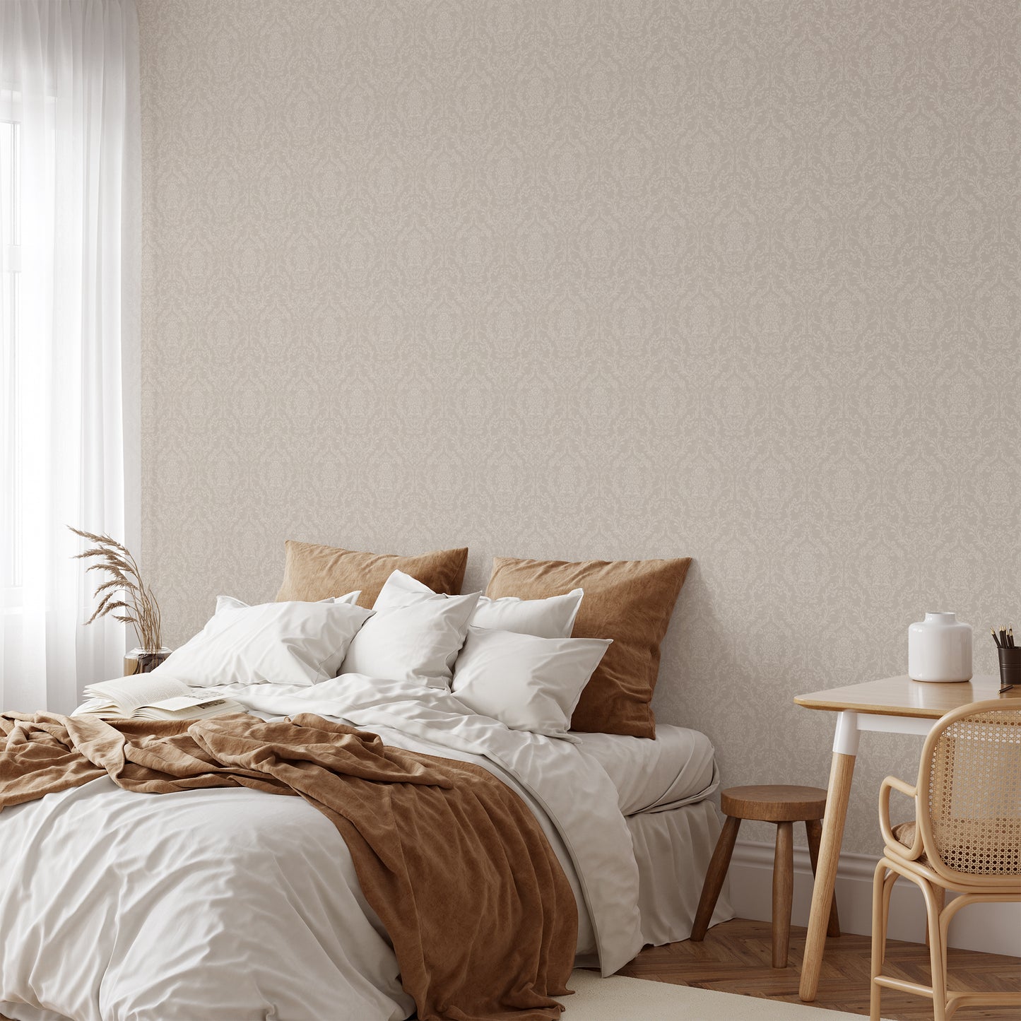 Mira Damask Wallpaper in Tan shown in a bedroom.