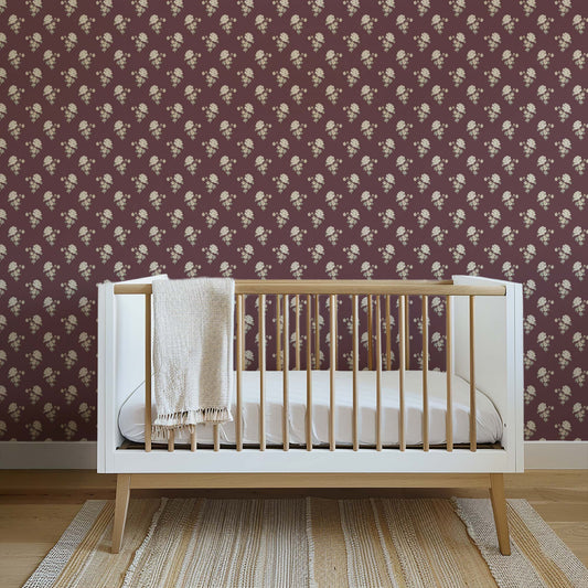 Foraged Peonies Wallpaper in Wine shown in a nursery