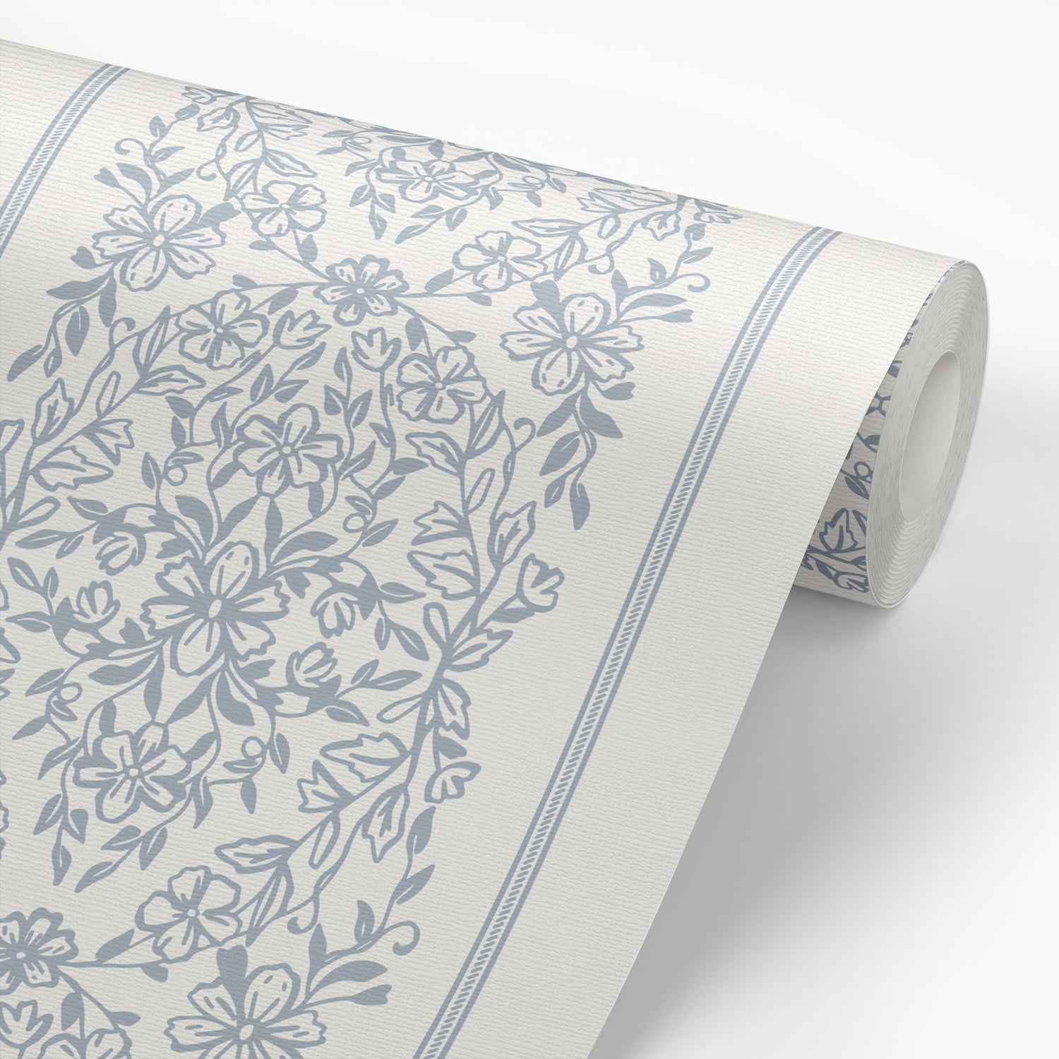 The classic and elevated design, adorned in a timeless blue hue, will add a sophisticated touch to any room. Shown on wallpaper roll.