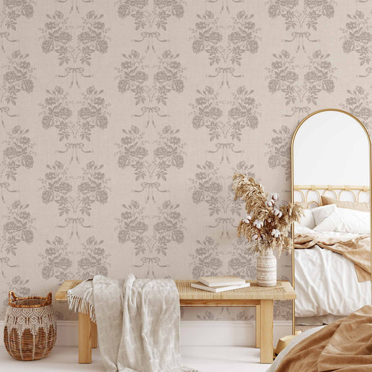 Roses and Ribbons Wallpaper in Mauve shown in a living room.