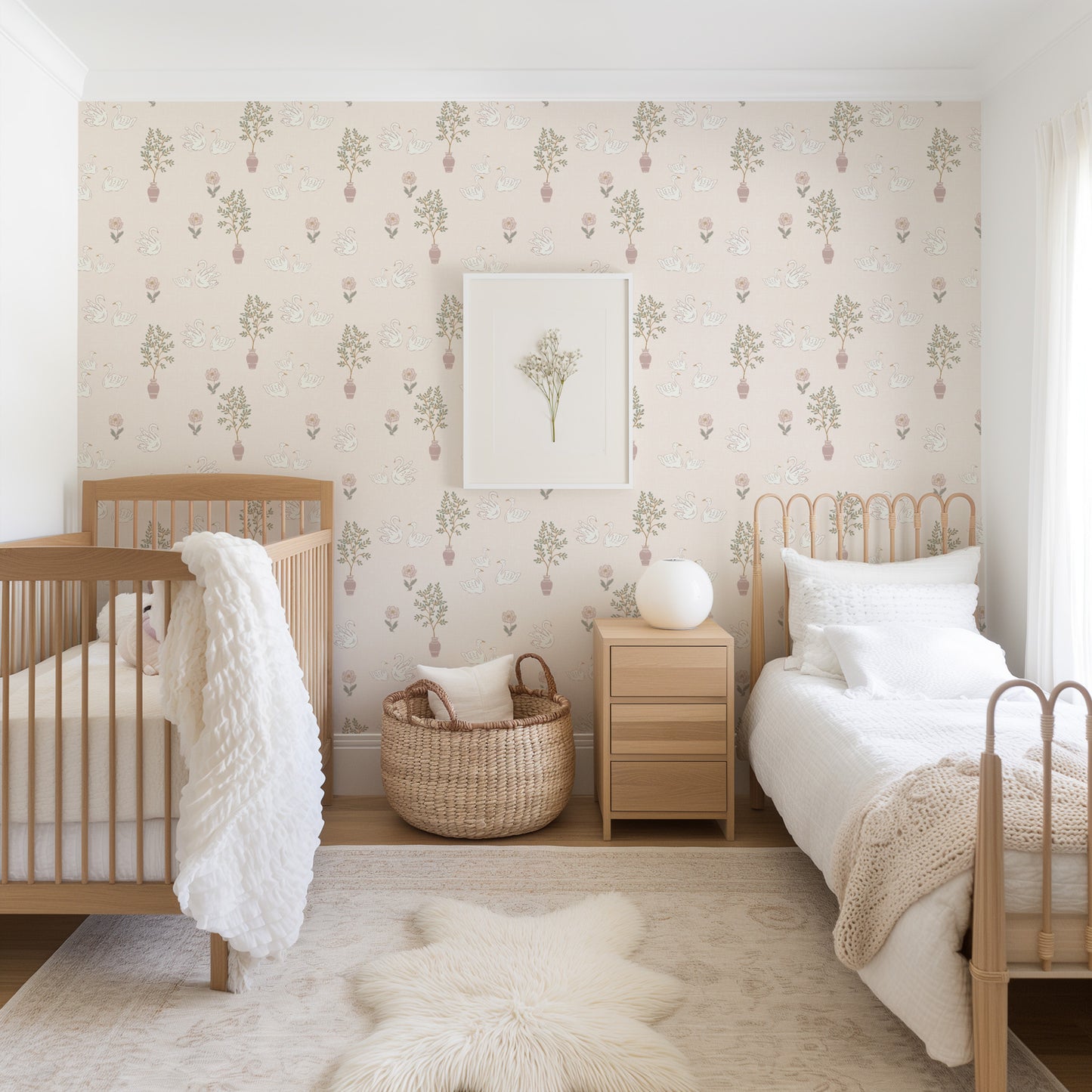 Nursery room with wooden crib, white bed, and decorative wallpaper.