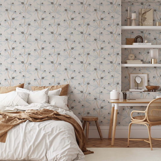 Coastal Sea Holly Wallpaper in Blue on Soft Gray shown in a bedroom