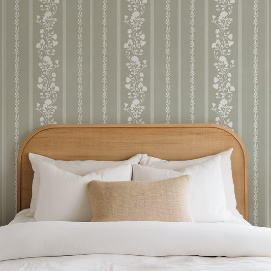 Sweet Floral Stripe Wallpaper in Sage shown in a bedroom