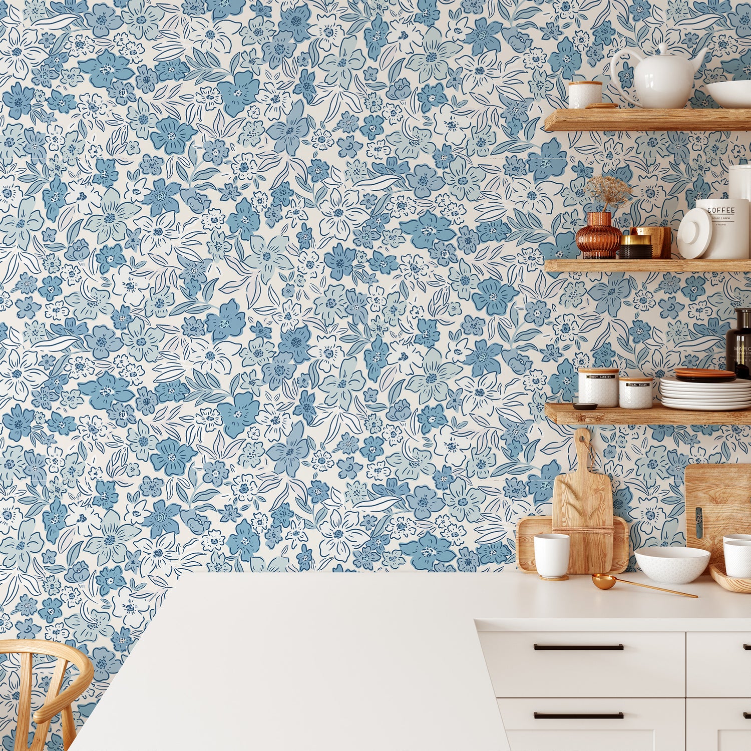 Introducing our Sweet Meadow Wallpaper in Cottage Blue, featuring a charming array of vibrant botanicals and scattered flowers in a calming blue hue shown in a full size image.