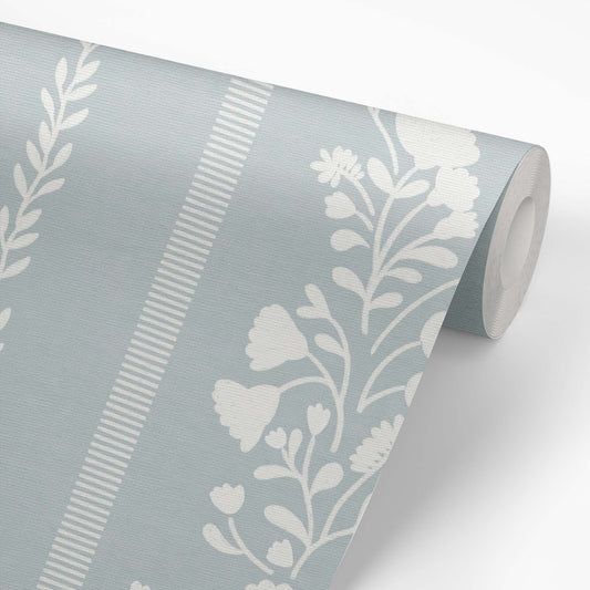 Sweet Floral Stripe Wallpaper in Cloudy Blue on a roll of wallpaper