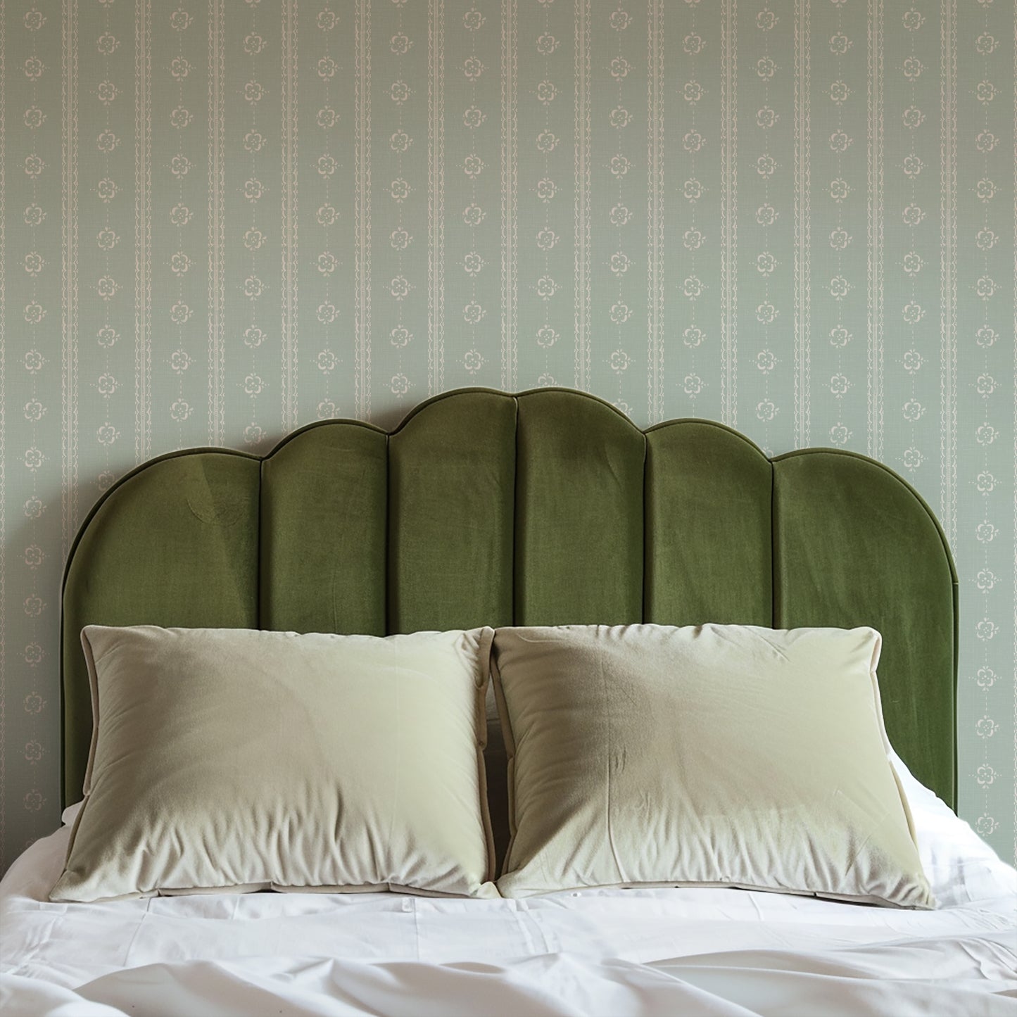 Time Worn Wallpaper in Sage shown in a bedroom.