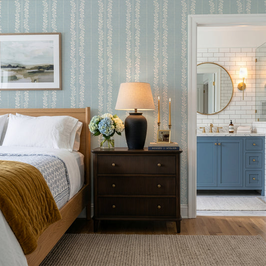 Timeless Florals Wallpaper in Blue shown in a bedroom.