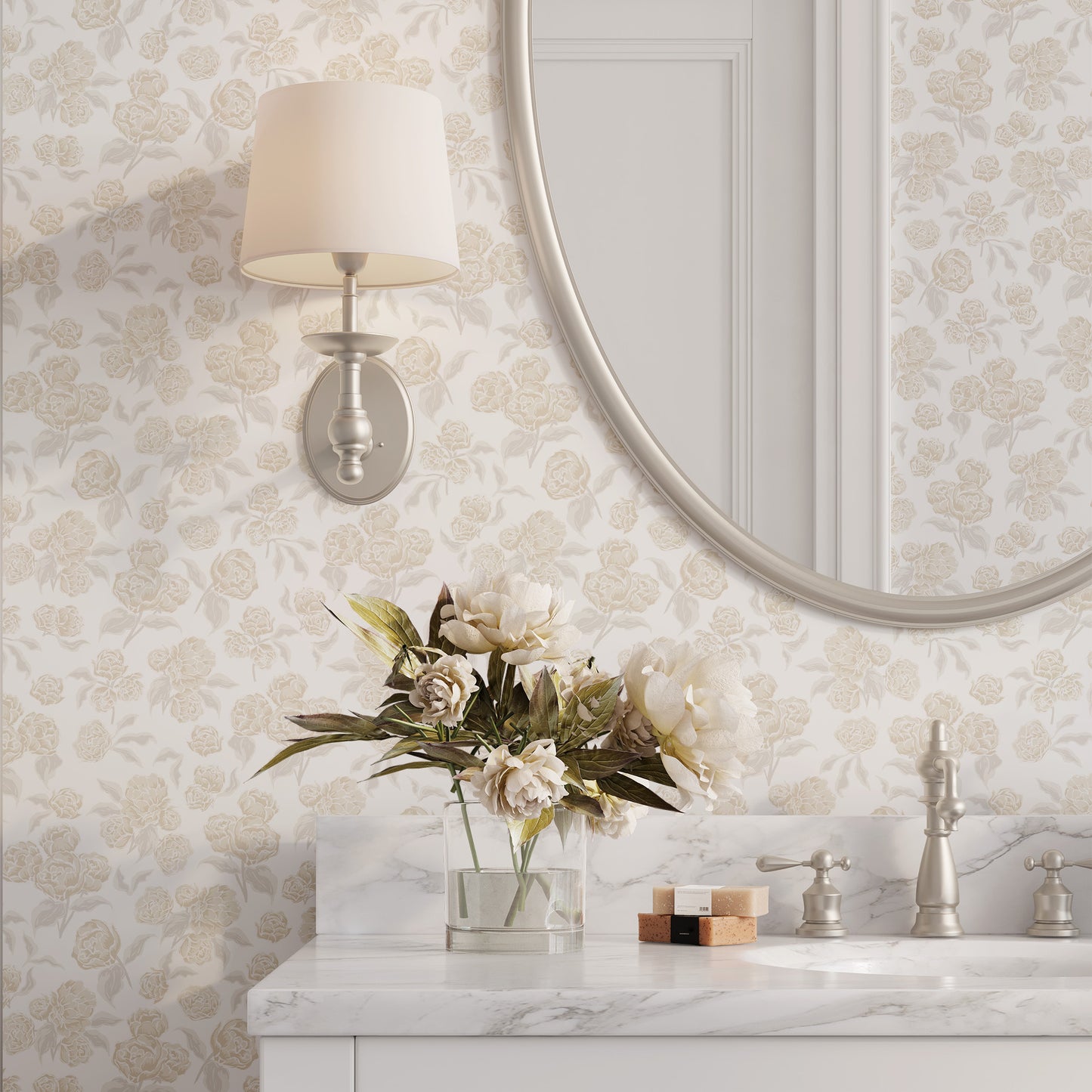 Bathroom with floral wallpaper and a marble countertop, round mirror, and wall lamp.