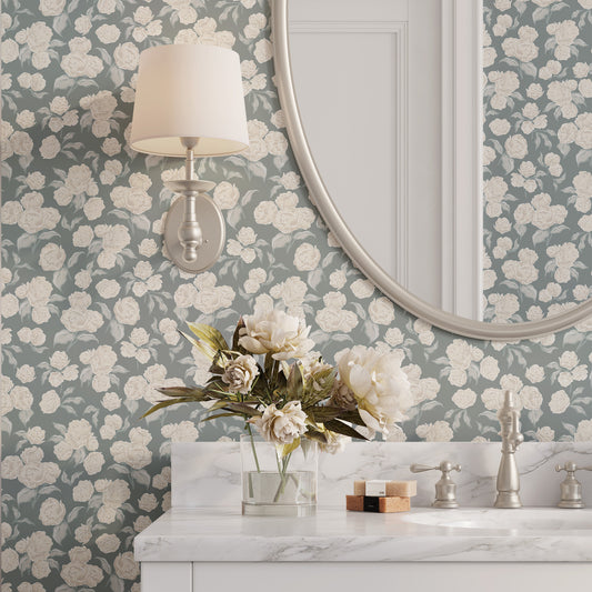 Bathroom with floral wallpaper, round mirror, and marble countertop.