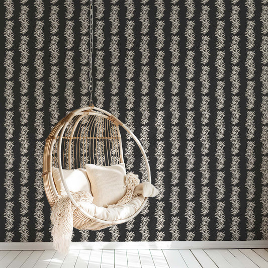 Vining Berries Wallpaper in Ash shown in a reading room