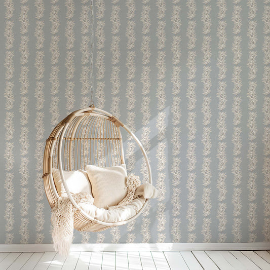 Our Vining Berries Wallpaper in Powder Blue shown in a reading room