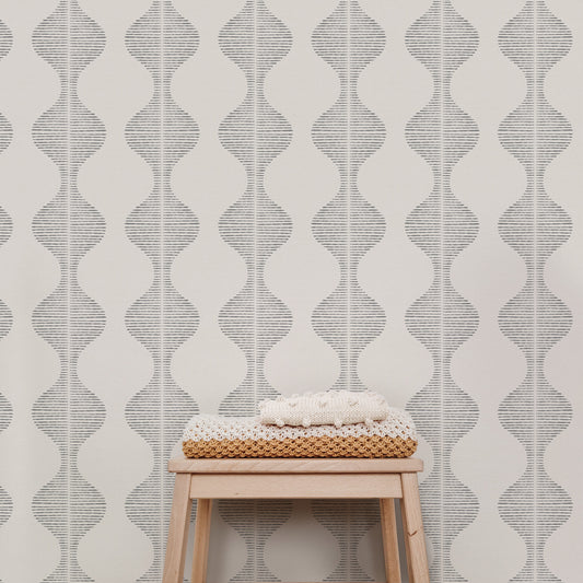 Bring a wave of modern beauty to any room with this stunning Wavy Line Art Wallpaper! The subtle gray on cream design is completely gorgeous and sure to make a statement in any space.