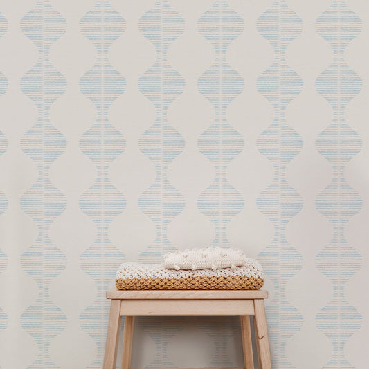 Bring a wave of modern beauty to any room with this stunning Wavy Line Art Wallpaper! The subtle pale blue on cream design is completely gorgeous and sure to make a statement in any space.