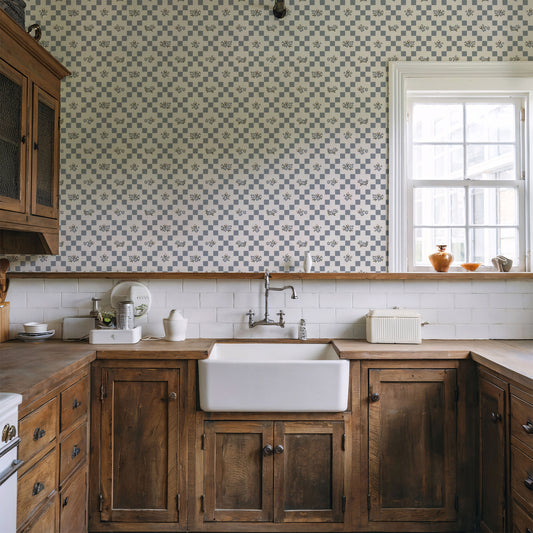 Vintage Bloom Mosaic Wallpaper in Dusty Blue shown in a kitchen.