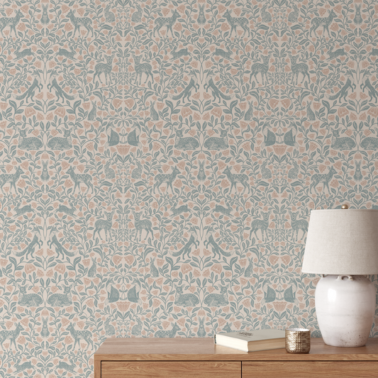 Wallpaper with animal pattern, wooden side table with lamp and books against a patterned wall.