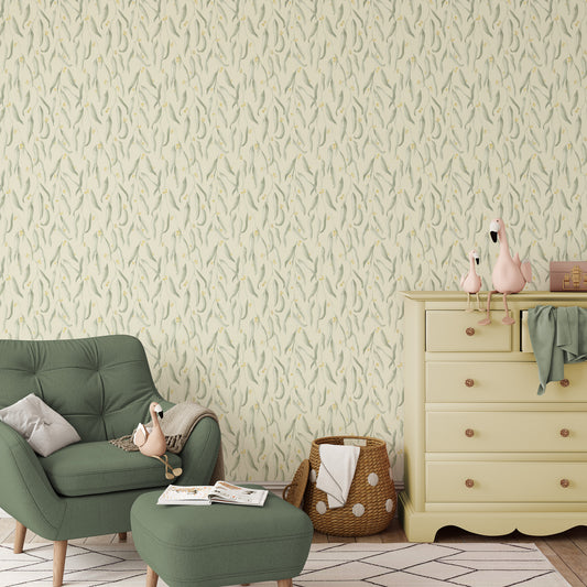 Bedroom with green chair, ottoman, and dresser against our Wattle in Sunlight Yellow wallpapered wall.