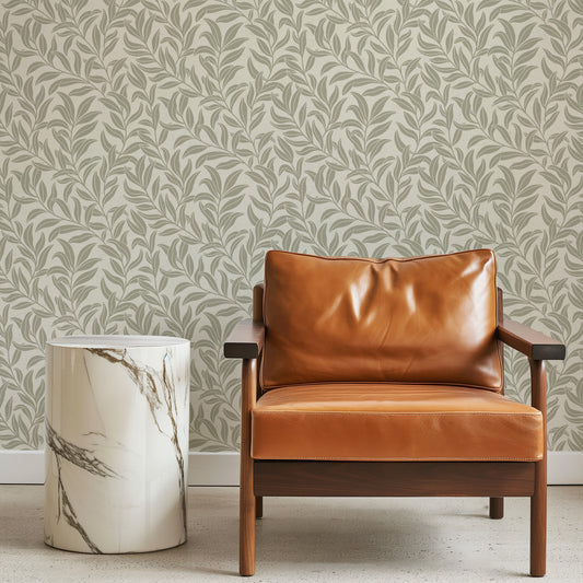 Winding Vines Wallpaper in Sage next to a leather sitting chair