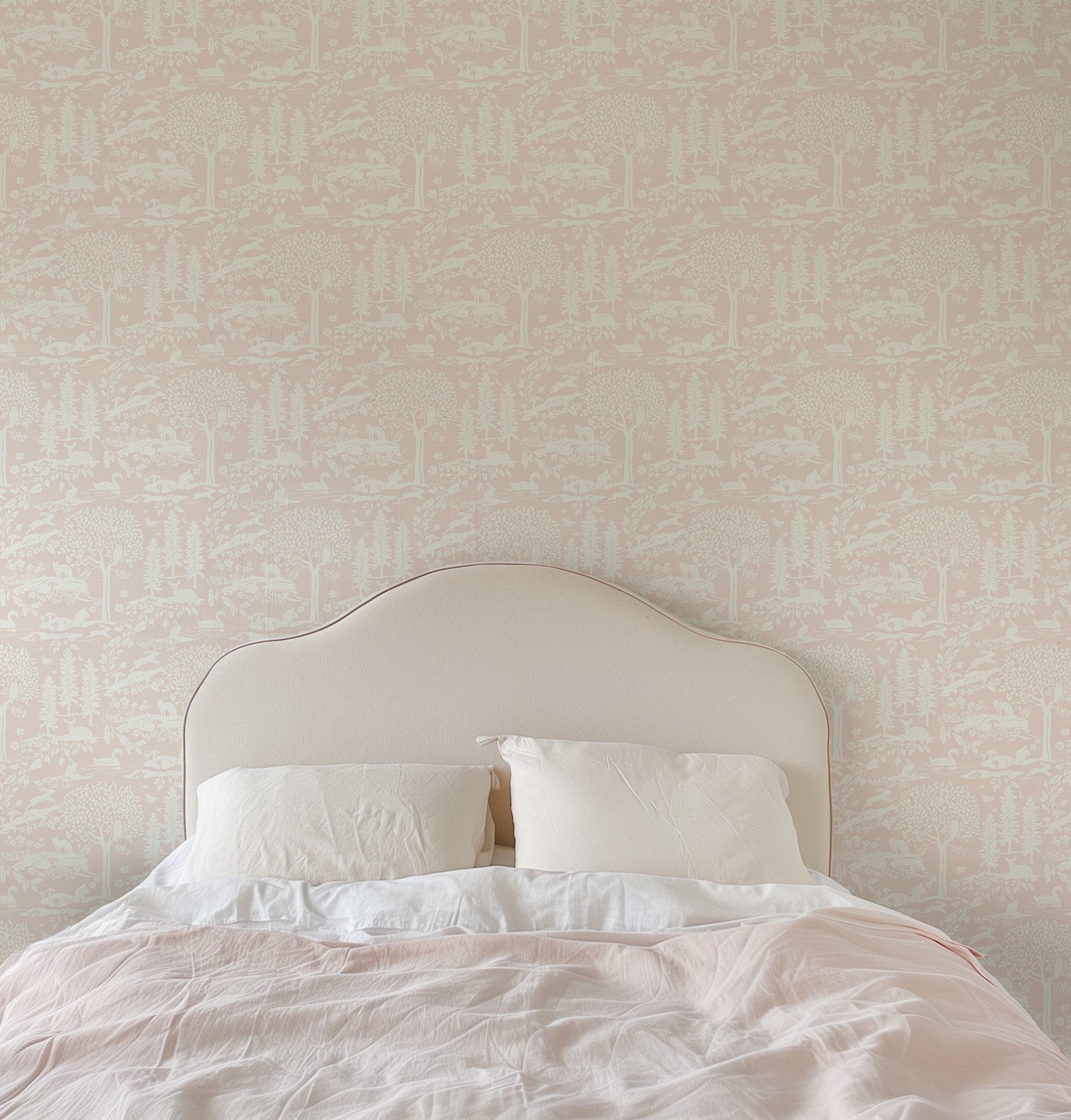 Woodland Meadows Wallpaper in Pink shown in a bedroom.