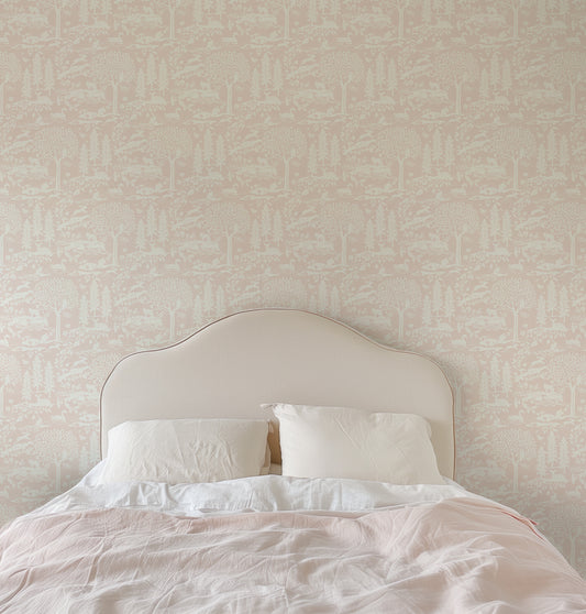 Woodland Meadows Wallpaper in Pink shown in a bedroom.