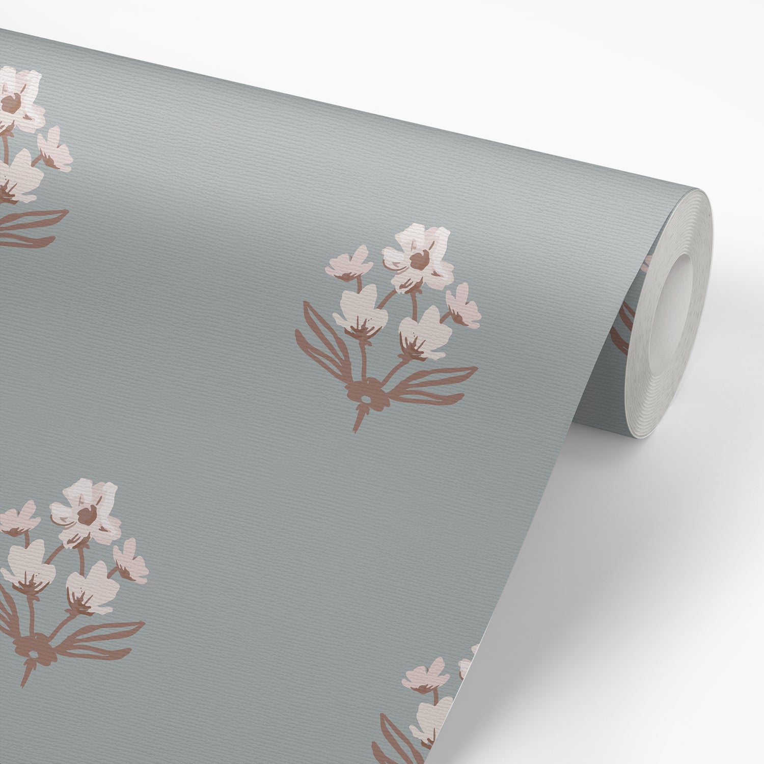 Folk Flowers Wallpaper in Denim shown on a wallpaper roll.