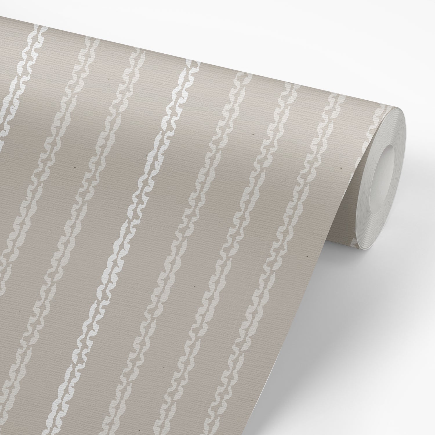 Wallpaper panel featuring Clea peel-and-stick wallpaper in clay by Jackie O'Bosky. Taupe and cream vertical stripes.