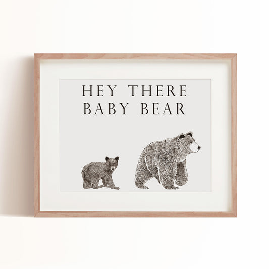 "Hey there baby bear" art print features text at the top and a mama bear and baby bear at the bottom of the print. The bears are hand sketched in pencil and are the perfect woodland animal art print for your nursery.