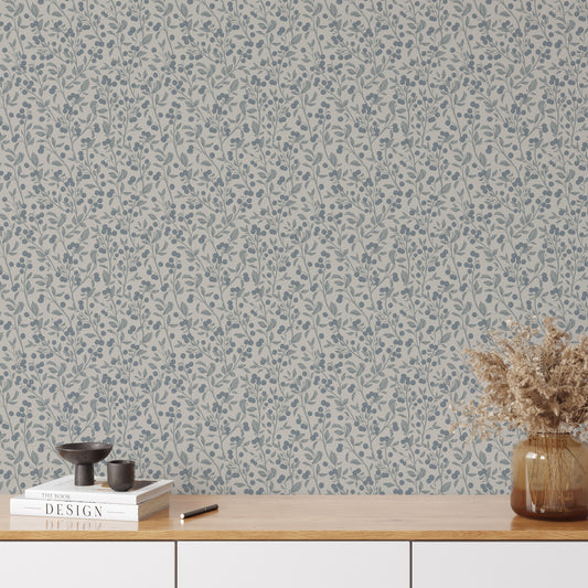 This mockup of our Berries Wallpaper in Gray and Blue shows our peel and stick, removable wallpaper with hand-drawn sketched berries in gray and blue by artist Mariah Cottrell.