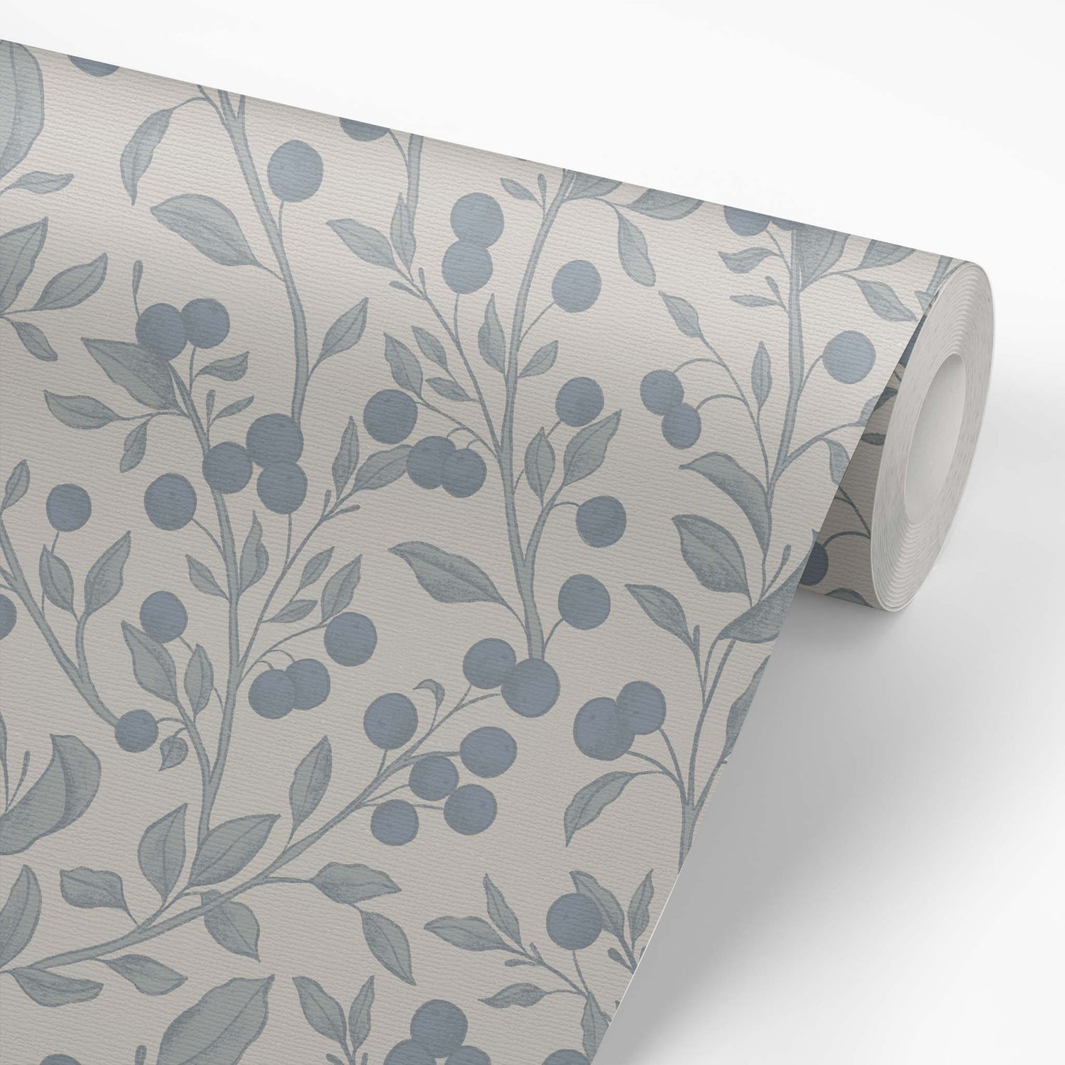 This wallpaper roll of our Berries Wallpaper in Gray and Blue shows our peel and stick, removable wallpaper with hand-drawn sketched berries in gray and blue by artist Mariah Cottrell.