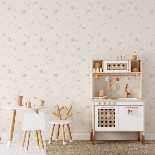 This playroom shows our Country Farm Wallpaper in Blue. This peel and stick, removable wallpaper was designed by artist Mariah Cottrell and features farm animals and trees in a countryside scene.