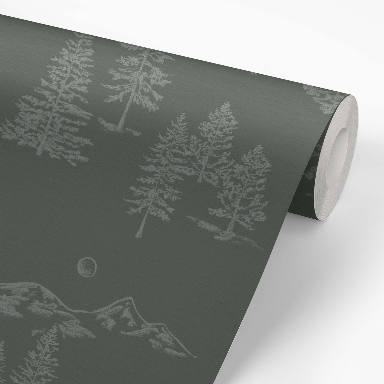 This wallpaper roll shows our Mountain Green Wallpaper in Dark Green. This peel and stick, removable wallpaper was designed by artist Mariah Cottrell and features beautifully sketched mountains and trees.